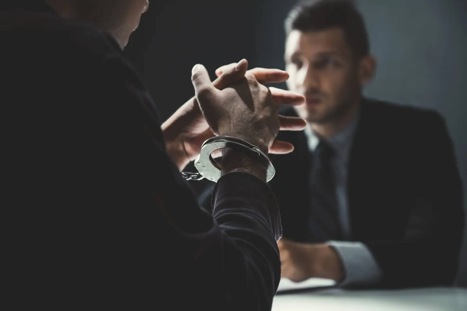Criminal defense attorney meeting with a client